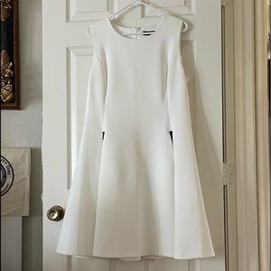 DKNY white fitted dress. Fully lined, two front pockets with zipper closure.